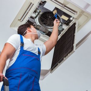 HVAC Tech working on ducts