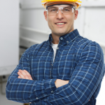 Smiling HVAC technician in crossed hands 